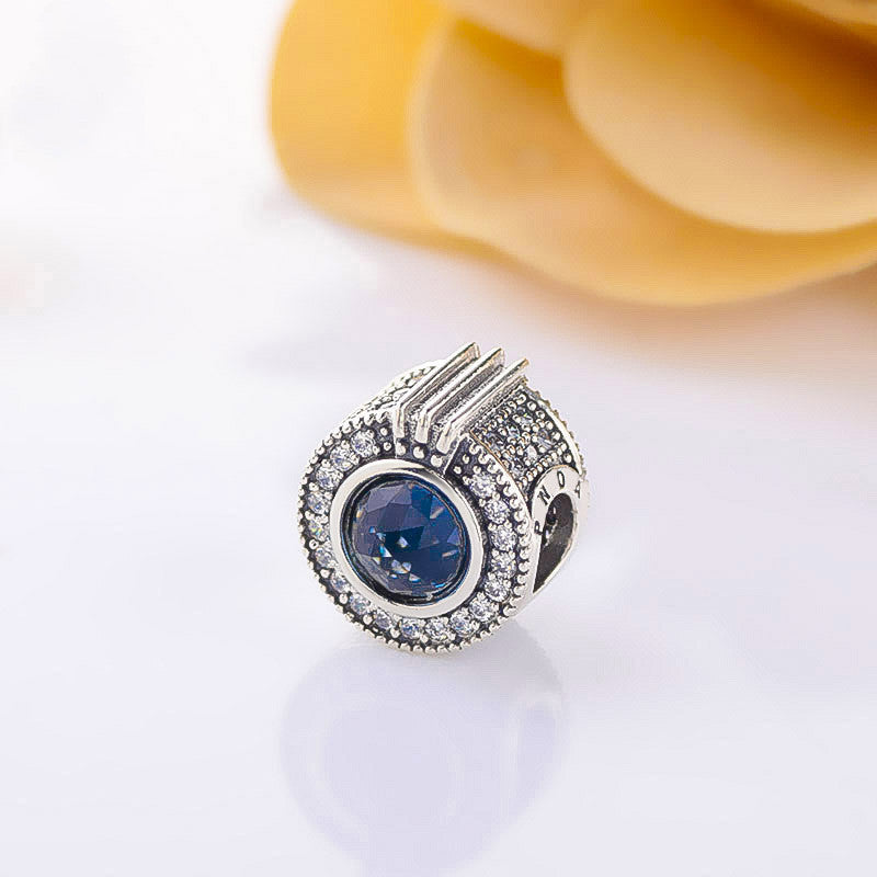 Brilliant pavé beads sparkling blue crown letter O charm